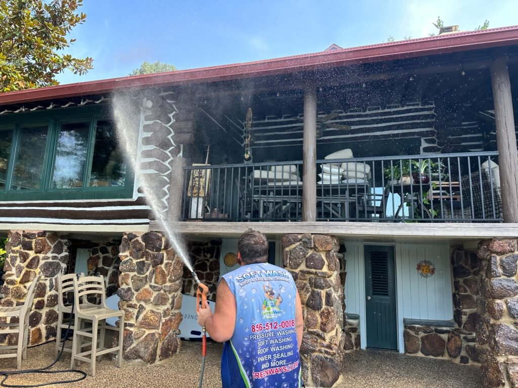 Aqua Boy technician soft washing a home in Medford NJ